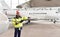 Airport workers check an aircraft for safety in a hangar