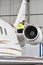 Airport workers check an aircraft for safety in a hangar