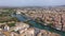 Airscape of French town Agde with view of tiled rooftops and river Herault.