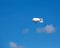 Airship with camera in the blue sky