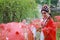 Aisa Chinese woman Peking Beijing Opera Costumes Pavilion garden China traditional role drama play bride hold red Umbrella