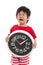 Aisan boy crying and holding clock