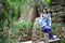 Aisan Chinese woman in traditional Blue and white Hanfu dress play in a garden