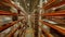 Aisle between high racks with packed products in warehouse