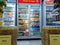 Aisle with various kinds of drinks on the Freezer shelves inside Minimarket