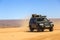 Ait Saoun, Morocco - February 22, 2016: Man driving toyota land cruiser in desert