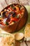 Ajapsandali Caucasian vegetarian appetizer served with pita bread closeup in a bowl. vertical