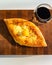 Ajarian traditional flatbread - khachapuri or hachapuri with egg and cheese