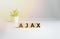 ajax - cube with letters and words on white background, software, internet categories, wooden cubes