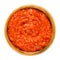 Ajvar in wooden bowl on white background