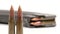 AK-47 ammunition 7,62x39mm, Defocus from a lying full magazine in the back to two upright bullets in the front