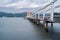 Akaroa jetty with shed and orange round conical roof at end