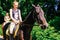 Akhal-Teke horse. Muzzle thoroughbred Akhal-Teke horse, photo outdoors. Ridden by a young rider. Saint-Petersburg. Russia. 06.18.