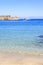 Akti sachtouri beach with Nailac tower on sea in Rhodes old town