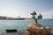 Akti Sachtouri sea promenade with Delphinia, statues of Dolphins. Rhodes, Old Town, Island of Rhodes, Greece. Europe