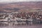 AKUREYRI, ICELAND - OCTOBER 19, 2014: Akureyri City Cityscape with Port, Gulf, Bay, and Snowy Mountain. Iceland.