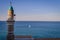 Al Bahr Mosque in the sunshine and a sailboat in the background