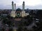 Al Barkah Mosque Largest Masjid in Bekasi, Ramadan Eid Concept background, Travel and tourism. with noise cloud after rain and