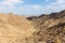 Al Hajar Mountains landscape seen from Copper Hike Summit, with rocky, dry riverbed wadi and barren mountain ridges, Hatta,