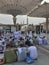 AL MADINAH, SAUDI ARABIA-CIRCA MAY 2019: Muslim men prepare to break fast at sunset outside Nabawi mosque in Medina, S.Arabia. Due