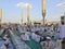 AL MADINAH, SAUDI ARABIA-CIRCA MAY 2019: Muslim men prepare to break fast at sunset outside Nabawi mosque in Medina, S.Arabia. Due