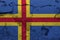 Aland flag painted on the cracked grunge concrete wall