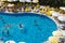 Alanya, Turkey - October 05, 2018. A group of people plays water polo in the blue clear water of the Kirman Sidera Luxury hotel