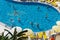 Alanya, Turkey - October 05, 2018. A group of people plays water polo in the blue clear water of the Kirman Sidera Luxury hotel