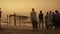 Alappuzha beach, south india, men contemplating sea at sunset