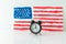 Alarm clock and abstract hand drawn American flag on background. President elections, Memorial Day, 4th of July or Labour Day