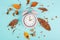 Alarm clock with autumn foliage, end of daylight saving time in fall, winter time changeover