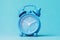 Alarm clock blue on a light background