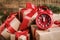 Alarm clock and Christmas gifts on wooden background, closeup. Boxing day
