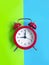 Alarm clock on a colored background reminder vintage decoration classic