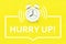 Alarm clock with hurry up text on yellow background