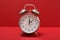 Alarm Clock Isolated on a red Background