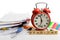 Alarm clock, over pile various documents Deadline business and finance concepts