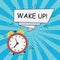 Alarm clock - Wake-Up. Comics illustration in pop art style at sunburst background with dot halftone effect and speech banner.