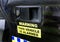 Alarm sign as warning on police vehicle.