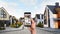 Alarm system. African-American man monitoring CCTV cameras on smartphone outdoors, closeup