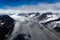 Alaska aerial landscape of mountaintops and wide glacial valleys and ice flows