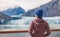 Alaska cruise inside passage to Glacier bay National Park woman tourist relaxing on deck watching landscape nature