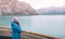 Alaska cruise Inside passage travel tourist woman looking at mountains landscape from balcony deck of ship. Glacier bay