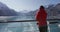 Alaska cruise ship passenger tourist looking at glacier in Glacier Bay