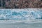 Alaska glacier front in Glacier Bay National Park. Blue Ice global warming. USA travel