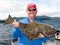 Alaska - Happy Man Holding Halibut