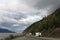 Alaska landscape with traveler car on the ALASKA HIGHWAY ROUTE,  forest and mountains