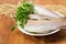 Alaska pollock carcasses on old rustic table with fishing net