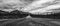 Alaska road under a dramatic sky in panoramic Black and White