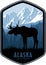 Alaska vector label with moose bull and mountains woodland forest